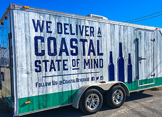Crystal Coast Graphics designed and custom wrapped this trailer for Coastal Beverage.