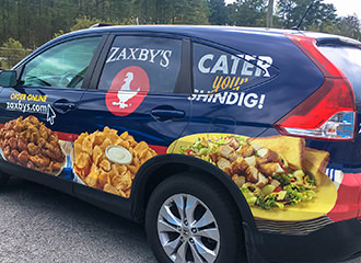 Crystal Coast Graphics designed and installed this Zaxby’s Catering vehicle wrap.