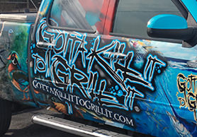 Gotta Kill It to Grill It truck wrap by Crystal Coast Graphics.